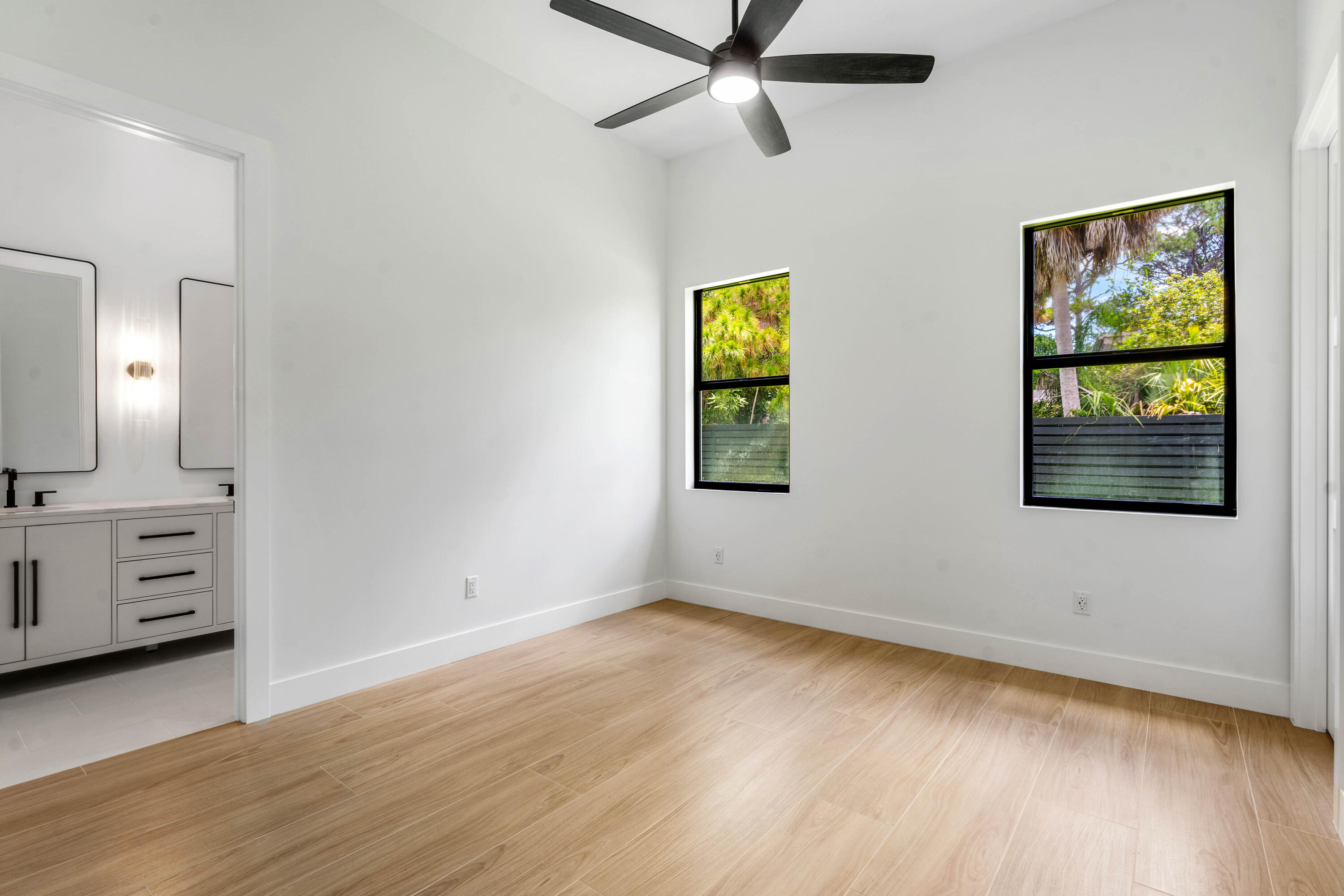 5701 Old Orange Road Jupiter, FL 33458 - Photo 39 of 46 wooden floor in an empty room with a window