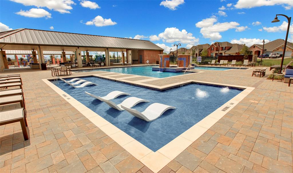 1813 Bachman Lane Forney, TX 75126 - Photo 12 of 18 a large pool table and chairs in a patio