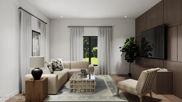a living room with furniture potted plant and a window