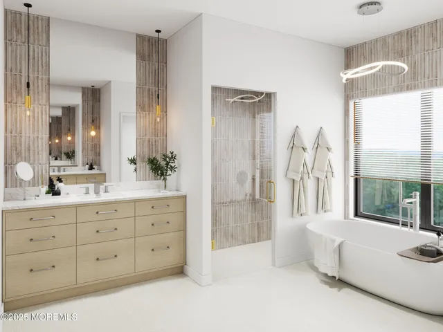 a spacious bathroom with double vanity sink a mirror a window and a glass door shower