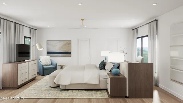 a bedroom with furniture and a flat screen tv