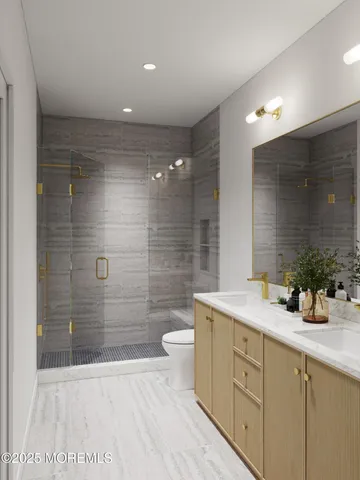 a bathroom with a double vanity sink toilet and shower