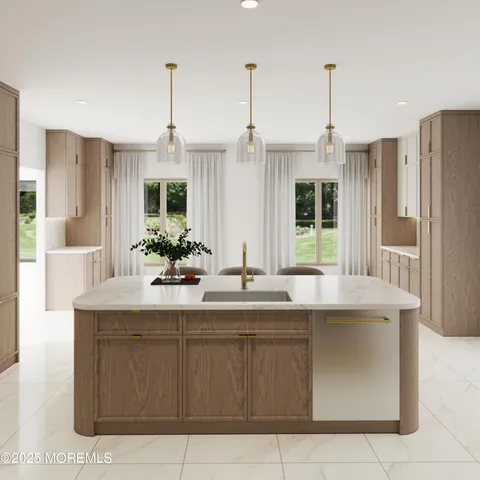a kitchen with kitchen island granite countertop a sink and dishwasher