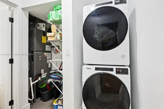 a close view of a utility room with dryer and washer