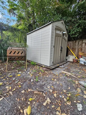 a backyard of a house with a tree