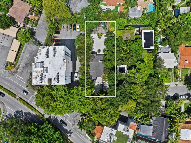 an aerial view of houses with yard