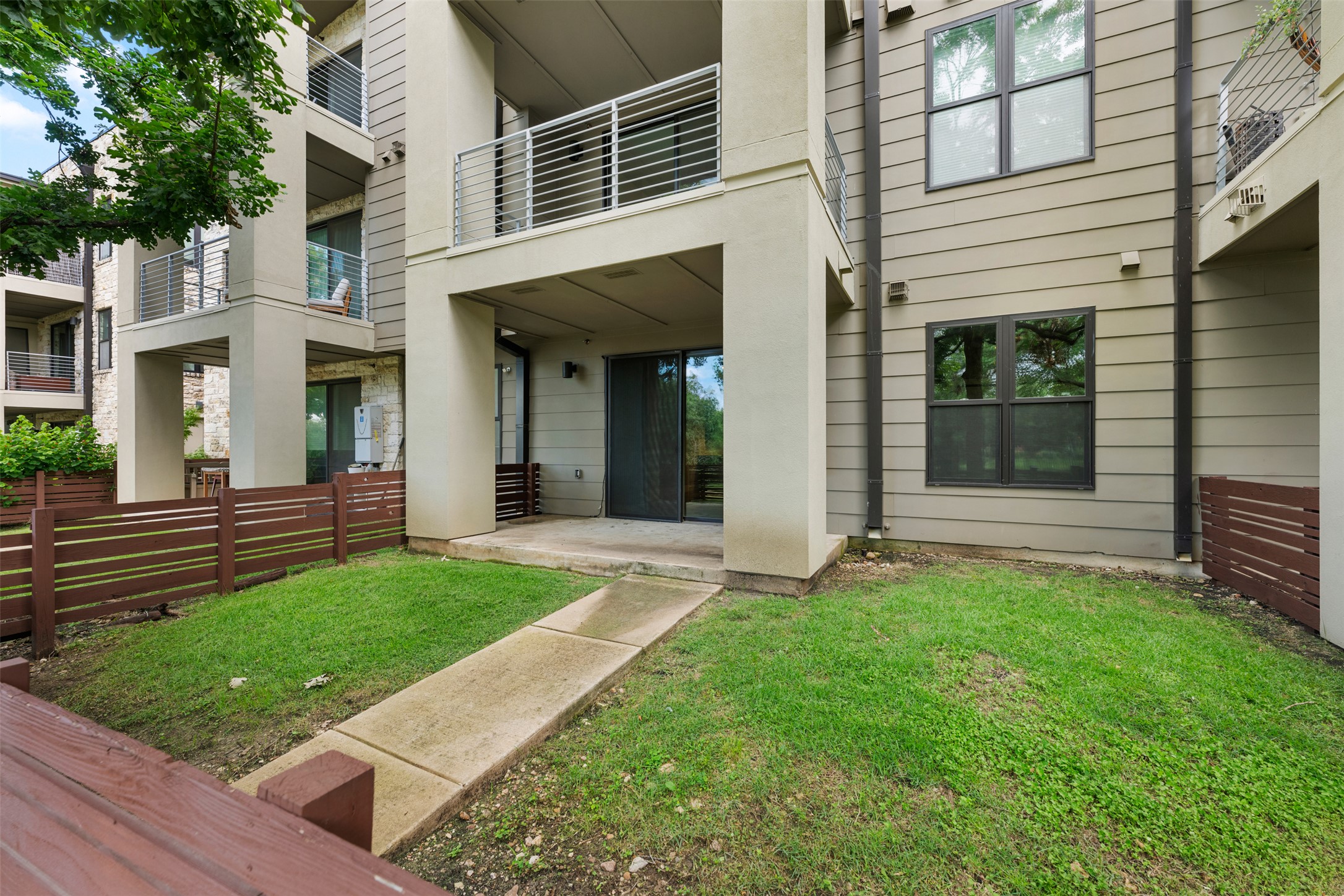 2804 Treble Lane, Unit 902 Austin, TX 78704 - Photo 26 of 31 front view of a house with a yard