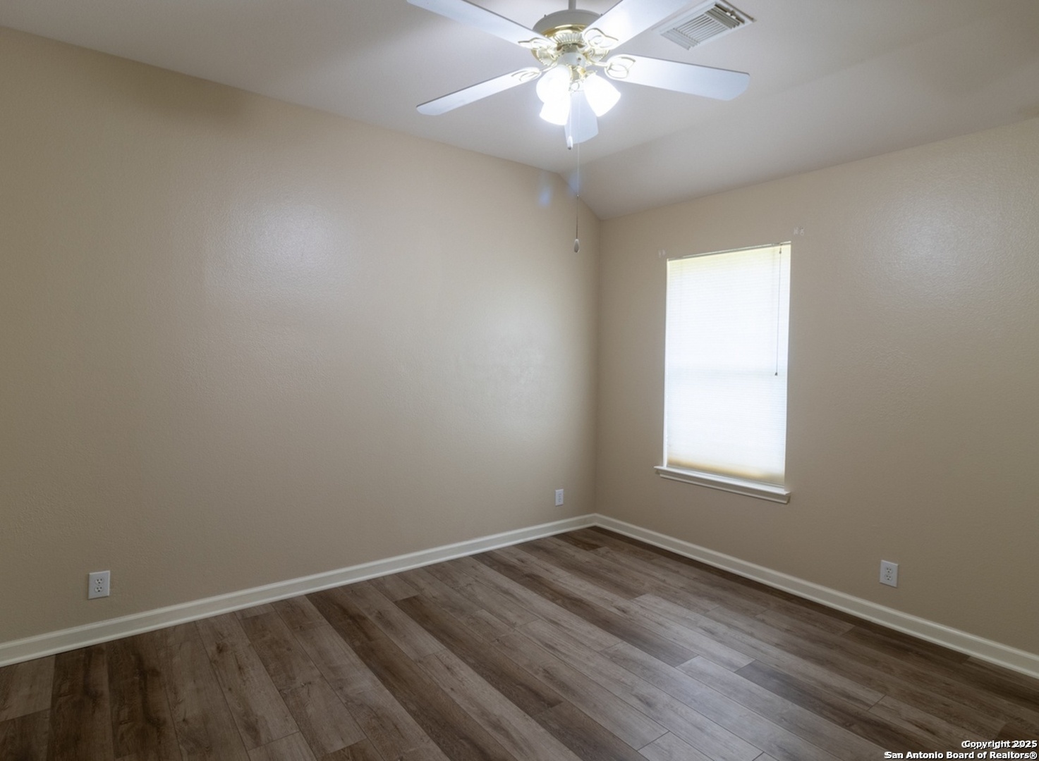 716 Broadleaf Schertz, TX 78154 - Photo 15 of 25 an empty room with wooden floor and windows