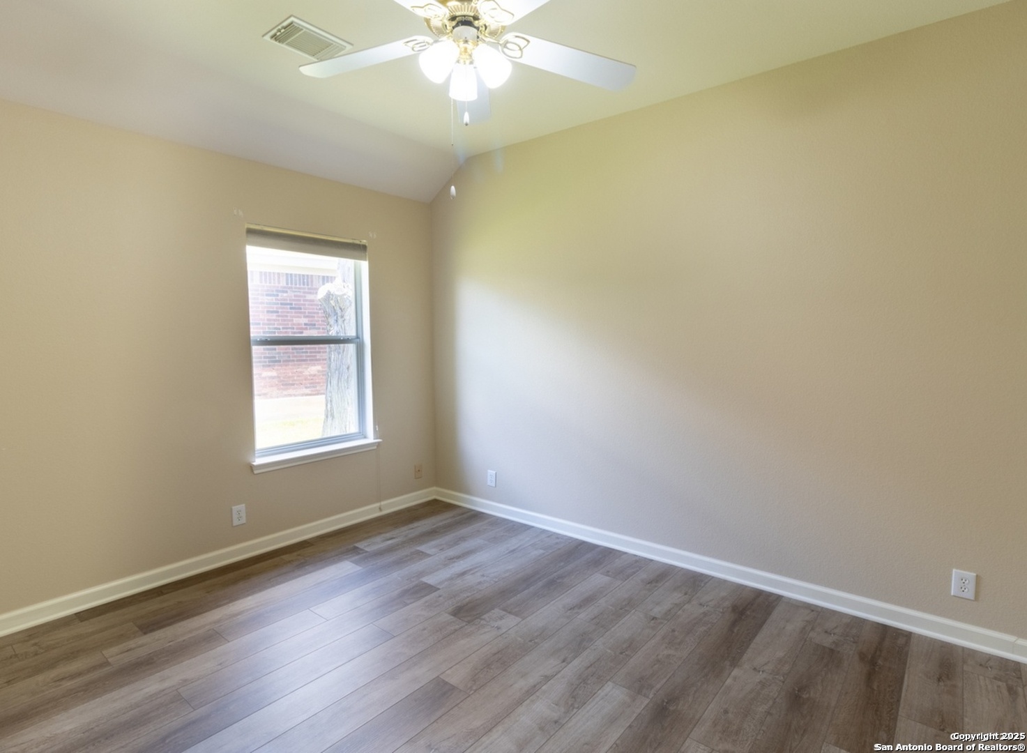 716 Broadleaf Schertz, TX 78154 - Photo 16 of 25 an empty room with wooden floor and windows