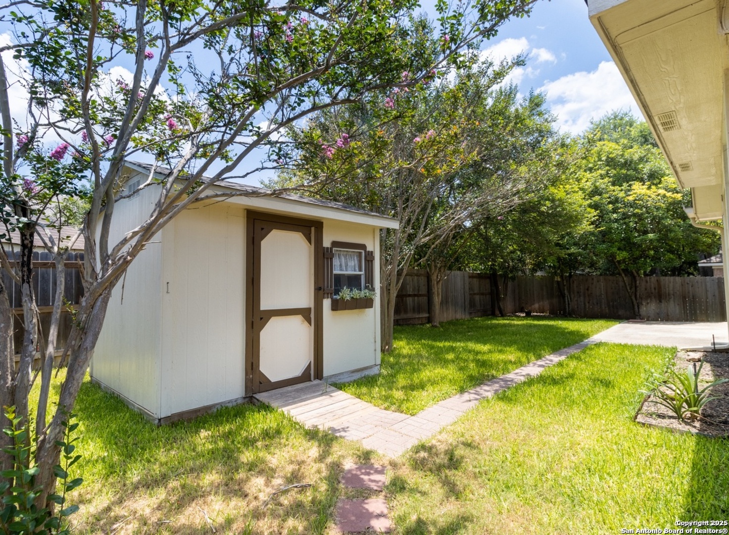 716 Broadleaf Schertz, TX 78154 - Photo 23 of 25 a backyard of a house with yard and barbeque oven
