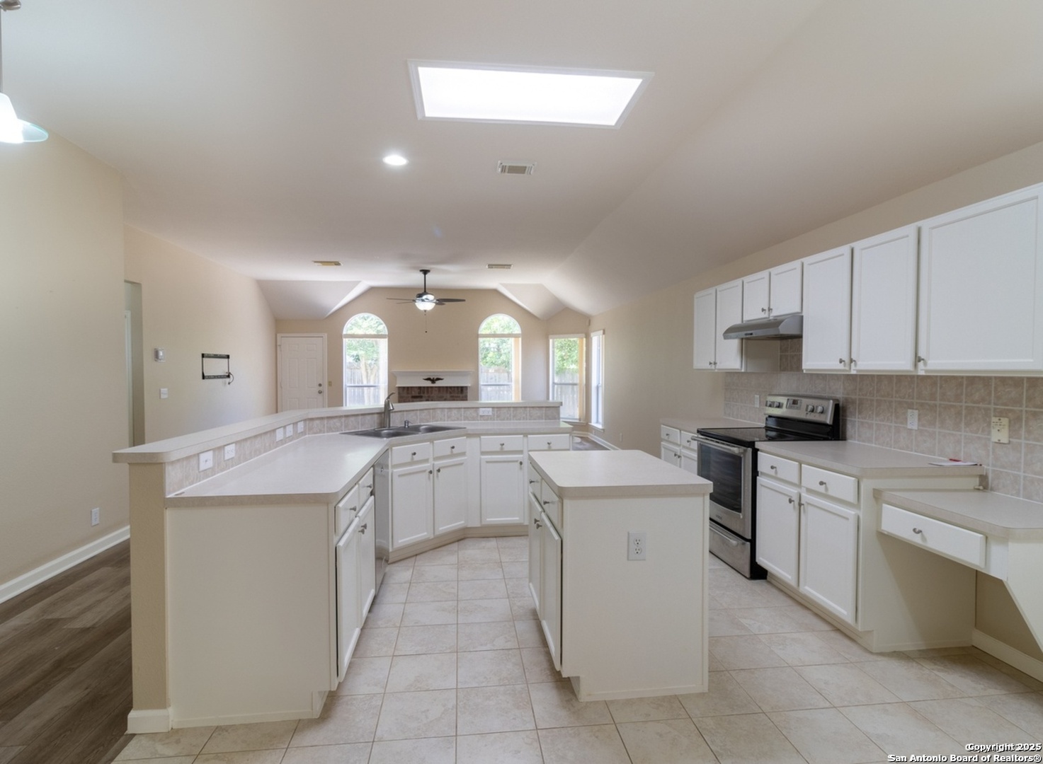 716 Broadleaf Schertz, TX 78154 - Photo 6 of 25 a kitchen with a sink and cabinets
