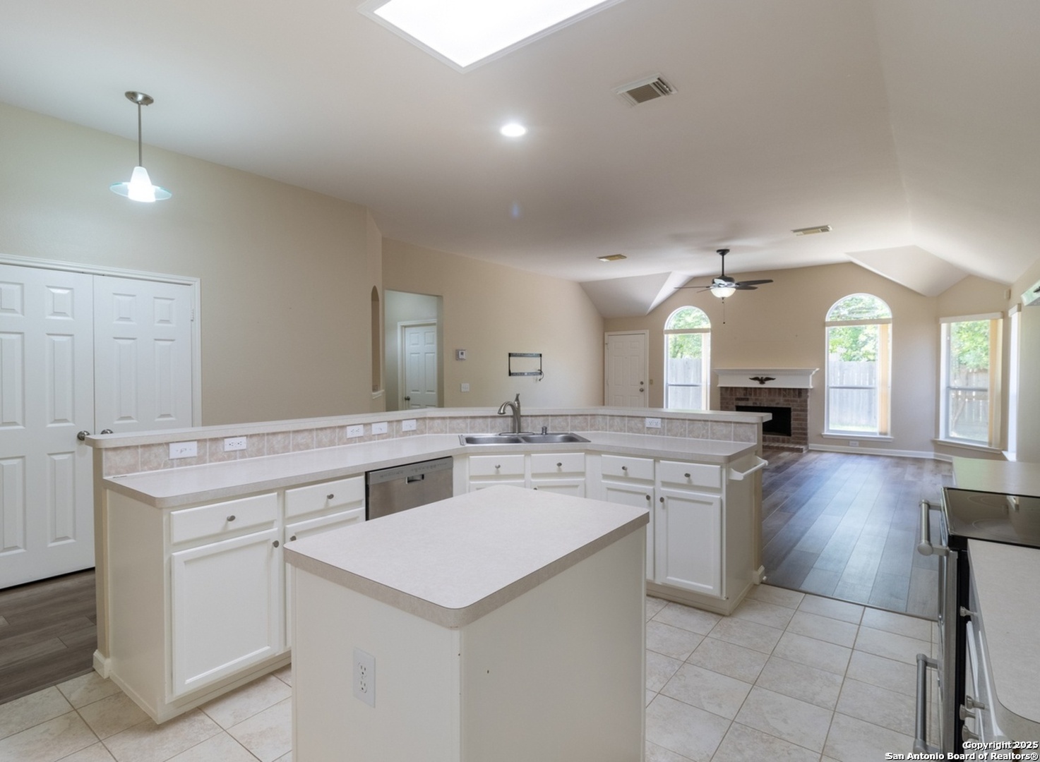 716 Broadleaf Schertz, TX 78154 - Photo 7 of 25 a kitchen with a sink stove and cabinets