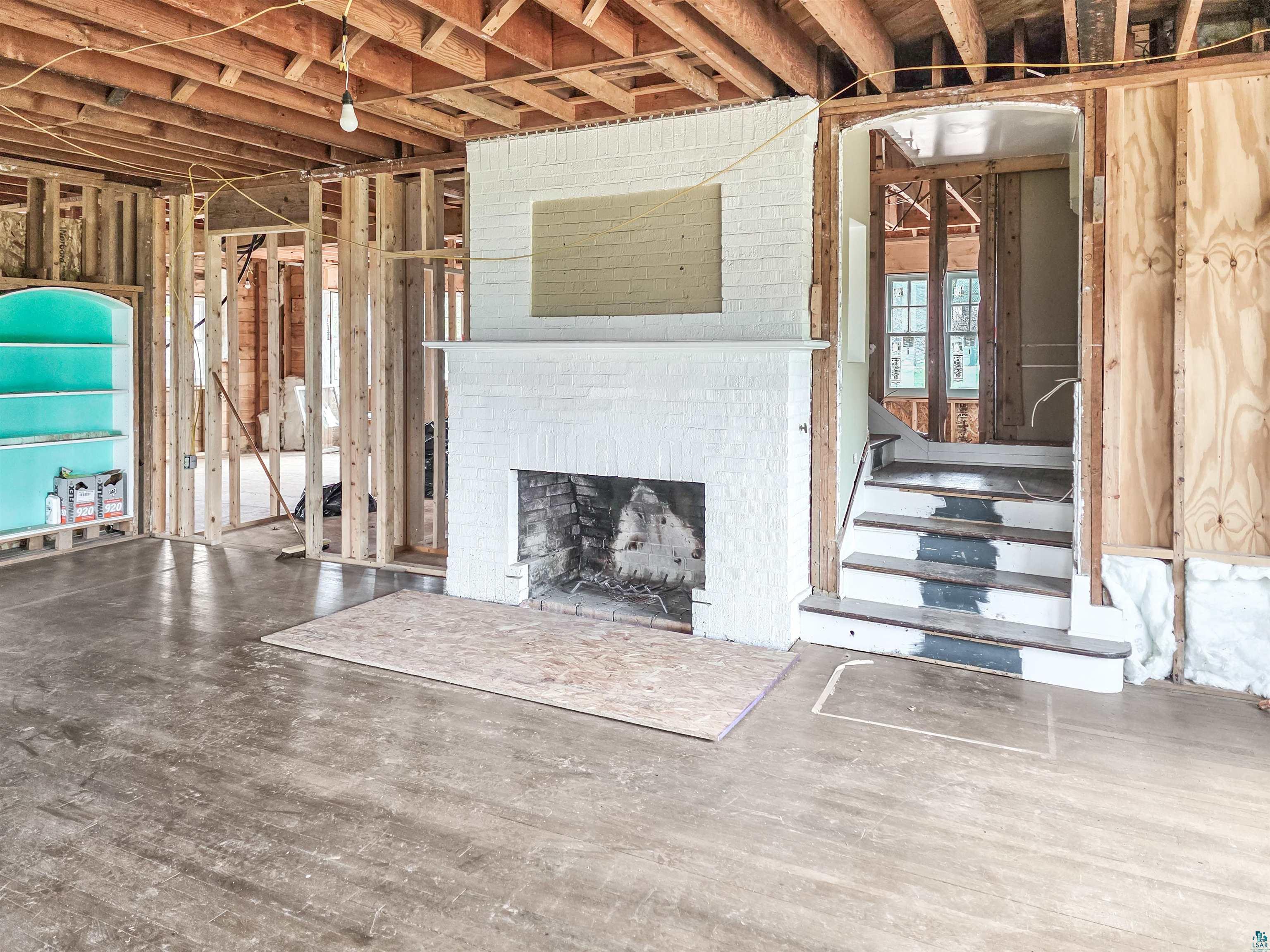 939 Whitefish Street La Pointe, WI 54850 - Photo 13 of 30 Interior structural framing featuring exposed ceiling joists and subflooring