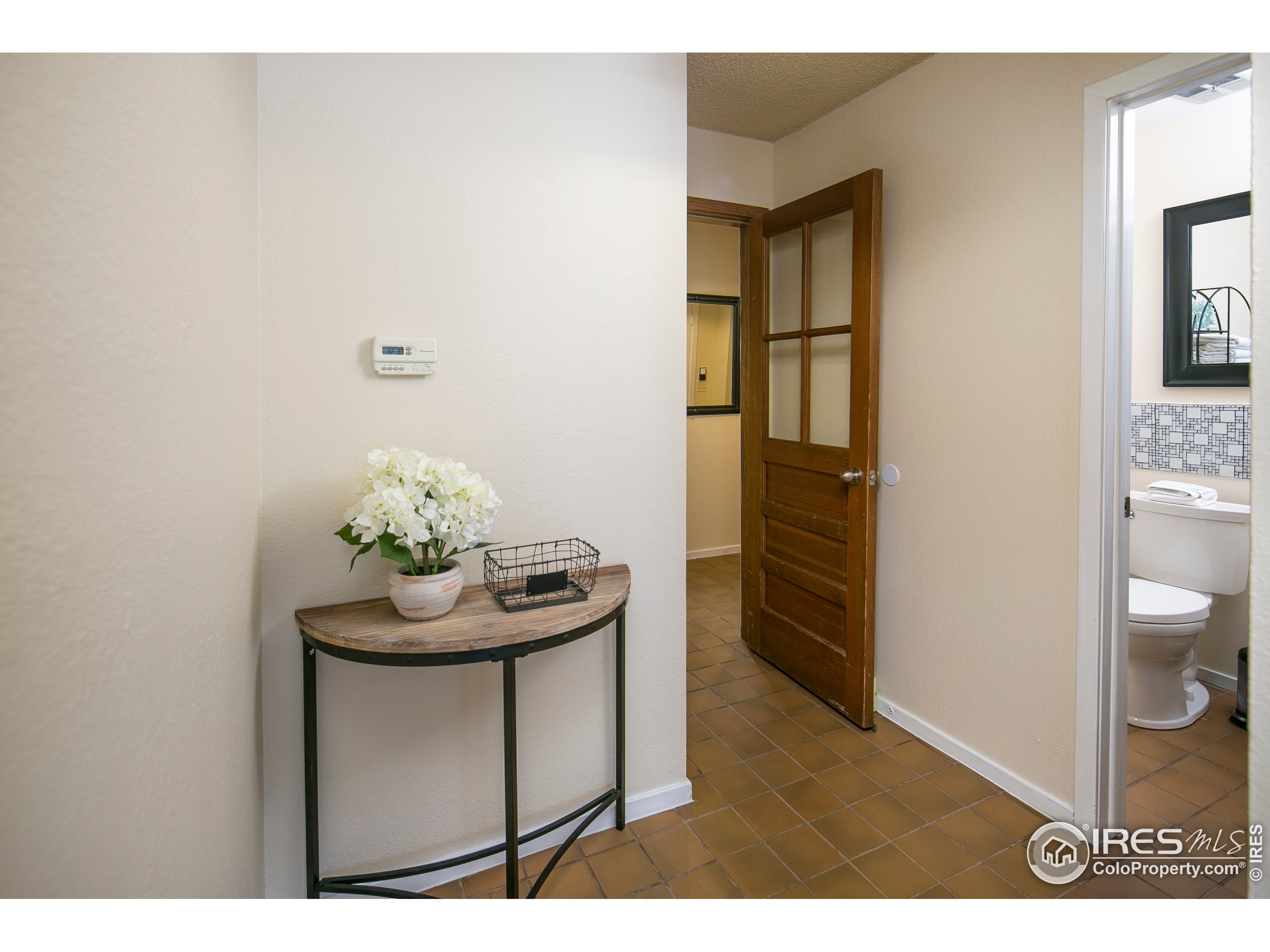 595 West Street Louisville, CO 80027 - Photo 11 of 26 a bathroom with a sink toilet and mirror