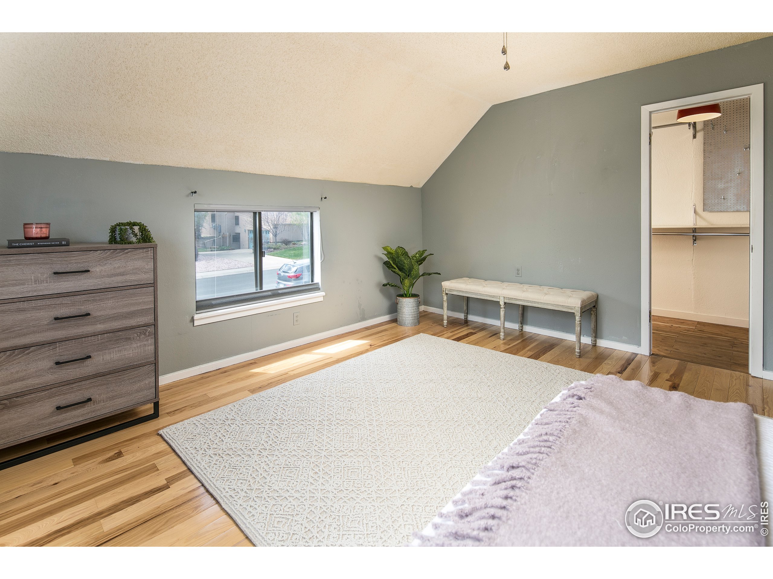 595 West Street Louisville, CO 80027 - Photo 15 of 26 a bedroom with a bed and a dresser