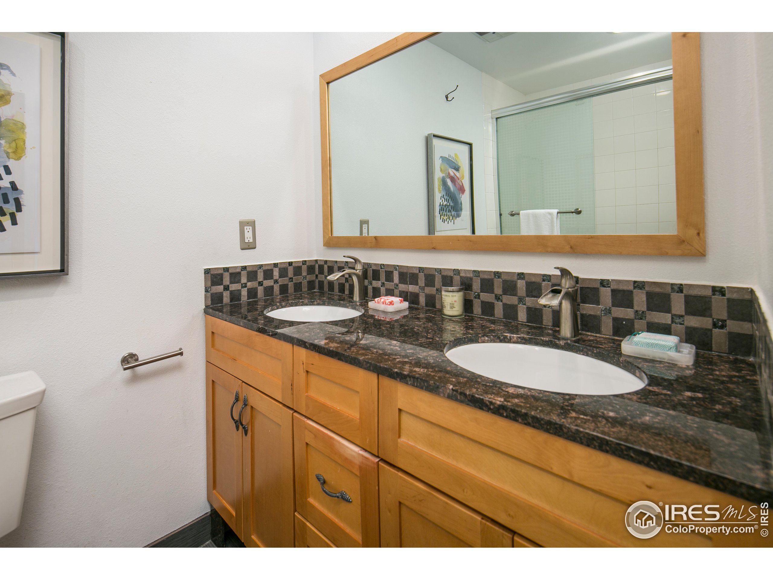 595 West Street Louisville, CO 80027 - Photo 17 of 26 a bathroom with a sink and a mirror