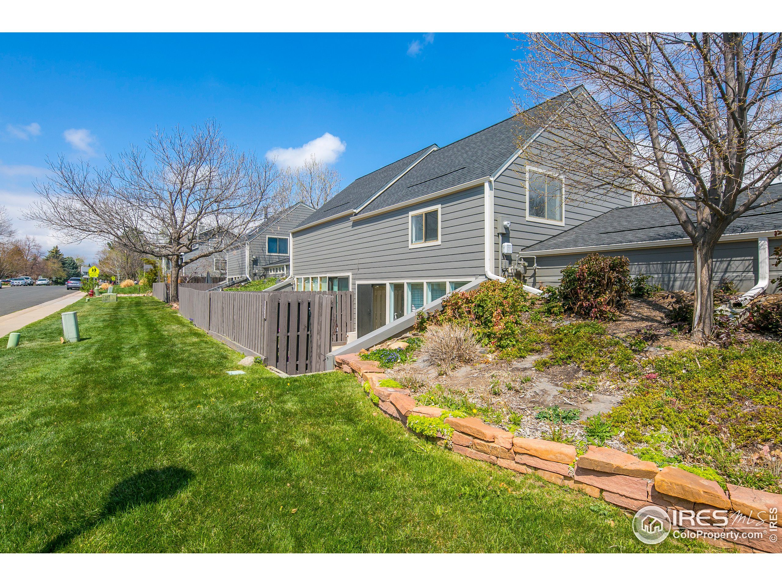 595 West Street Louisville, CO 80027 - Photo 2 of 26 a view of a house with a yard