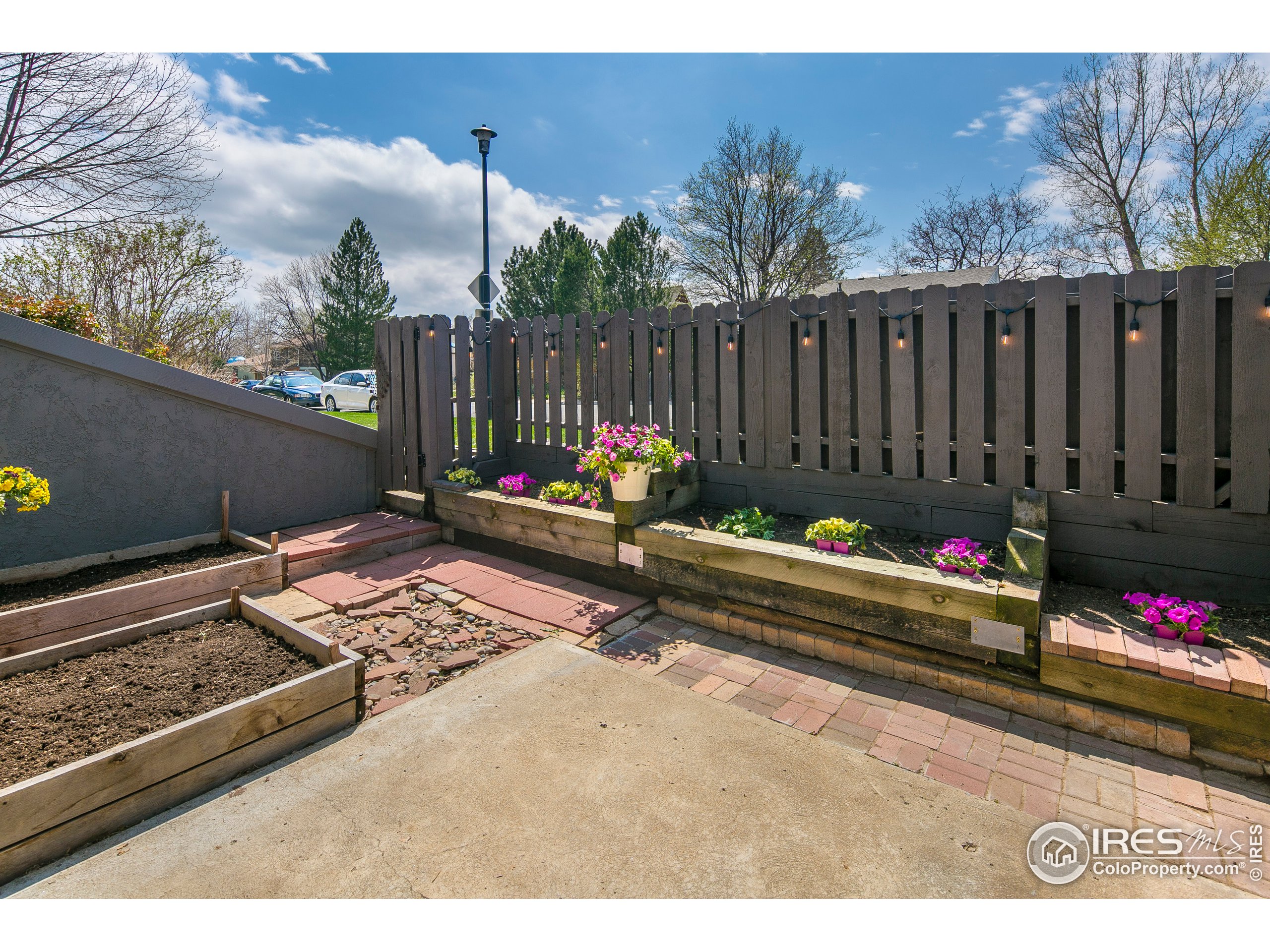 595 West Street Louisville, CO 80027 - Photo 21 of 26 a backyard of a house with table and chairs