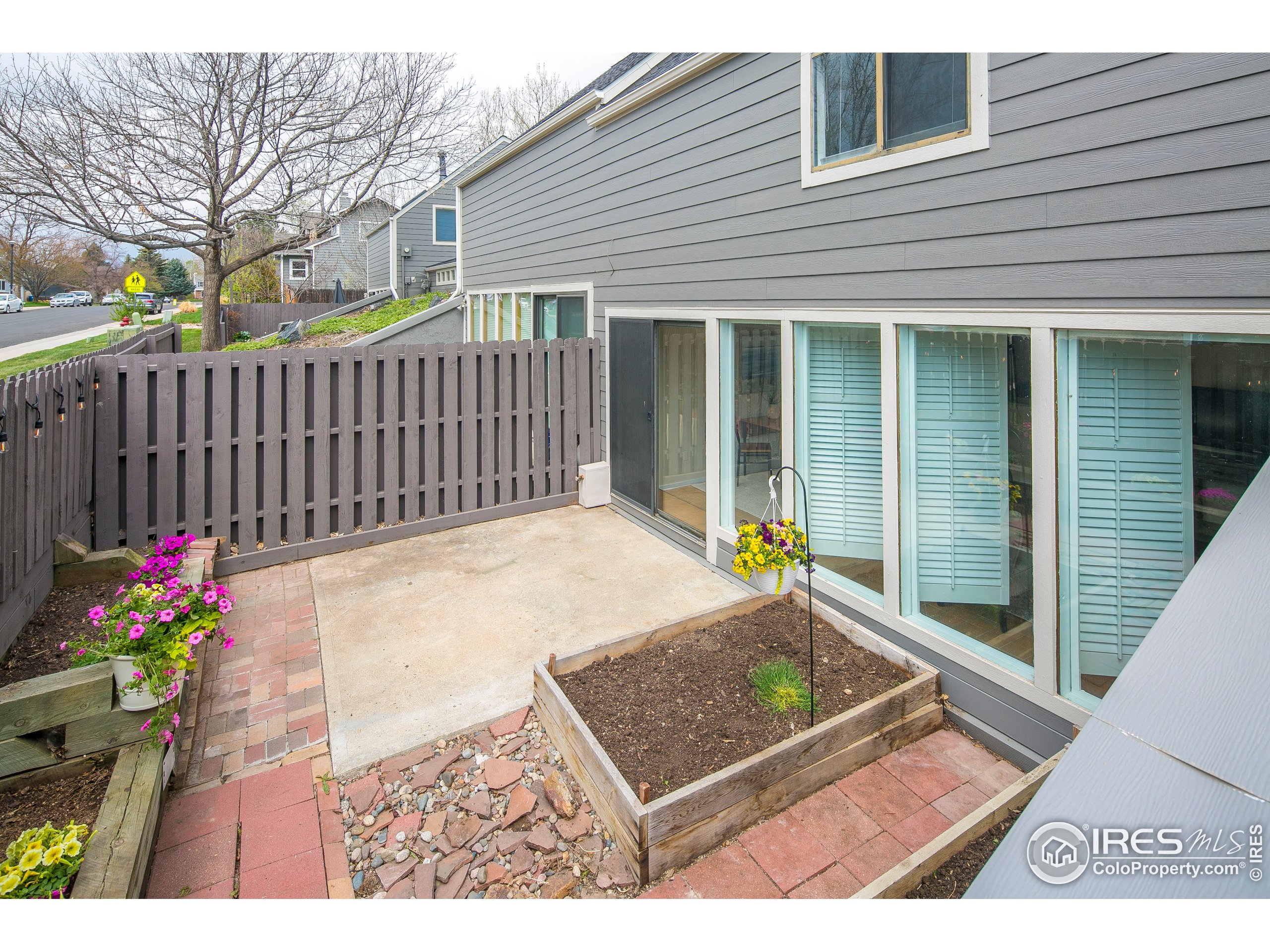 595 West Street Louisville, CO 80027 - Photo 22 of 26 a view of a backyard with a garden