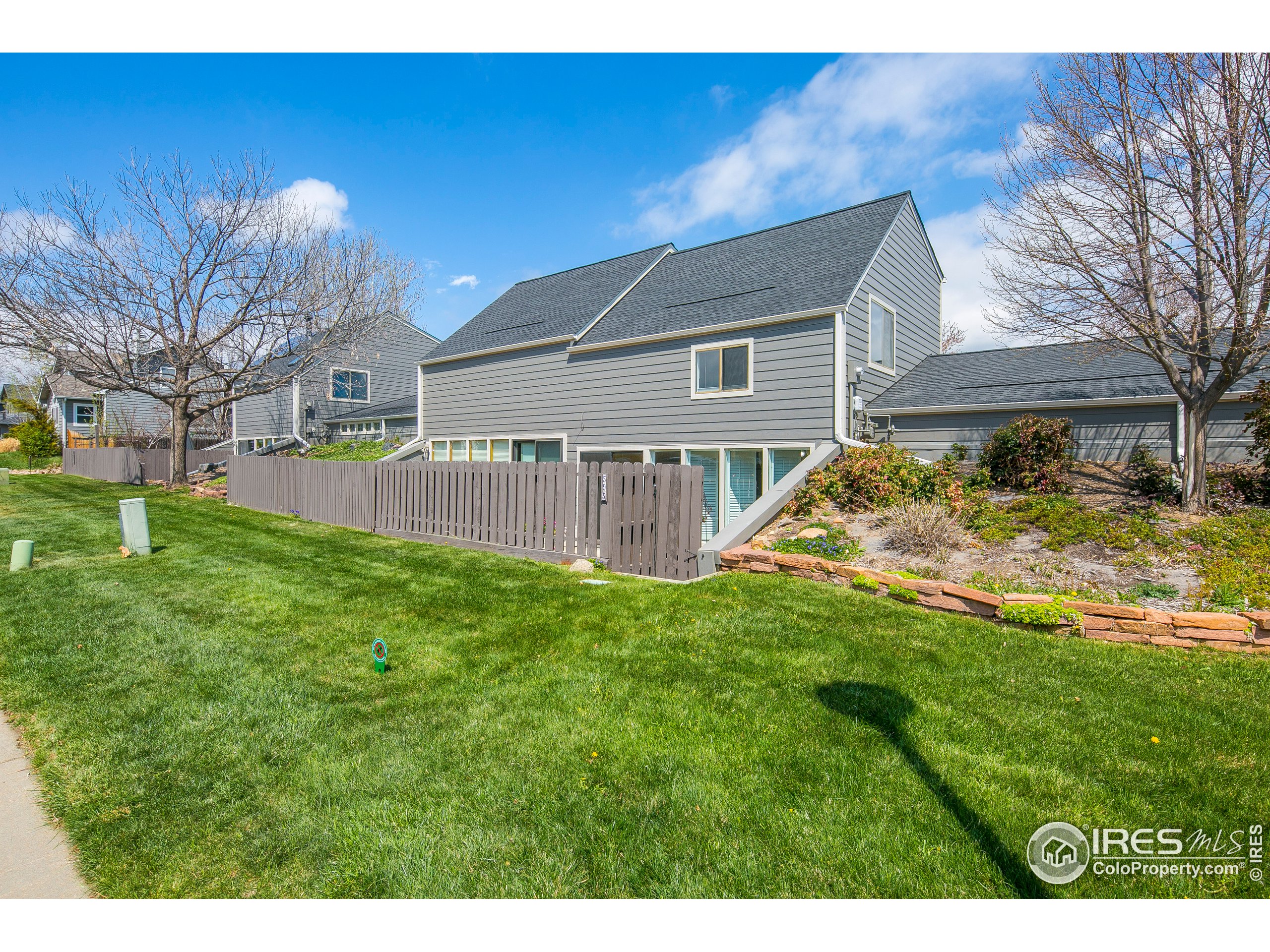 595 West Street Louisville, CO 80027 - Photo 26 of 26 a view of a house with a yard