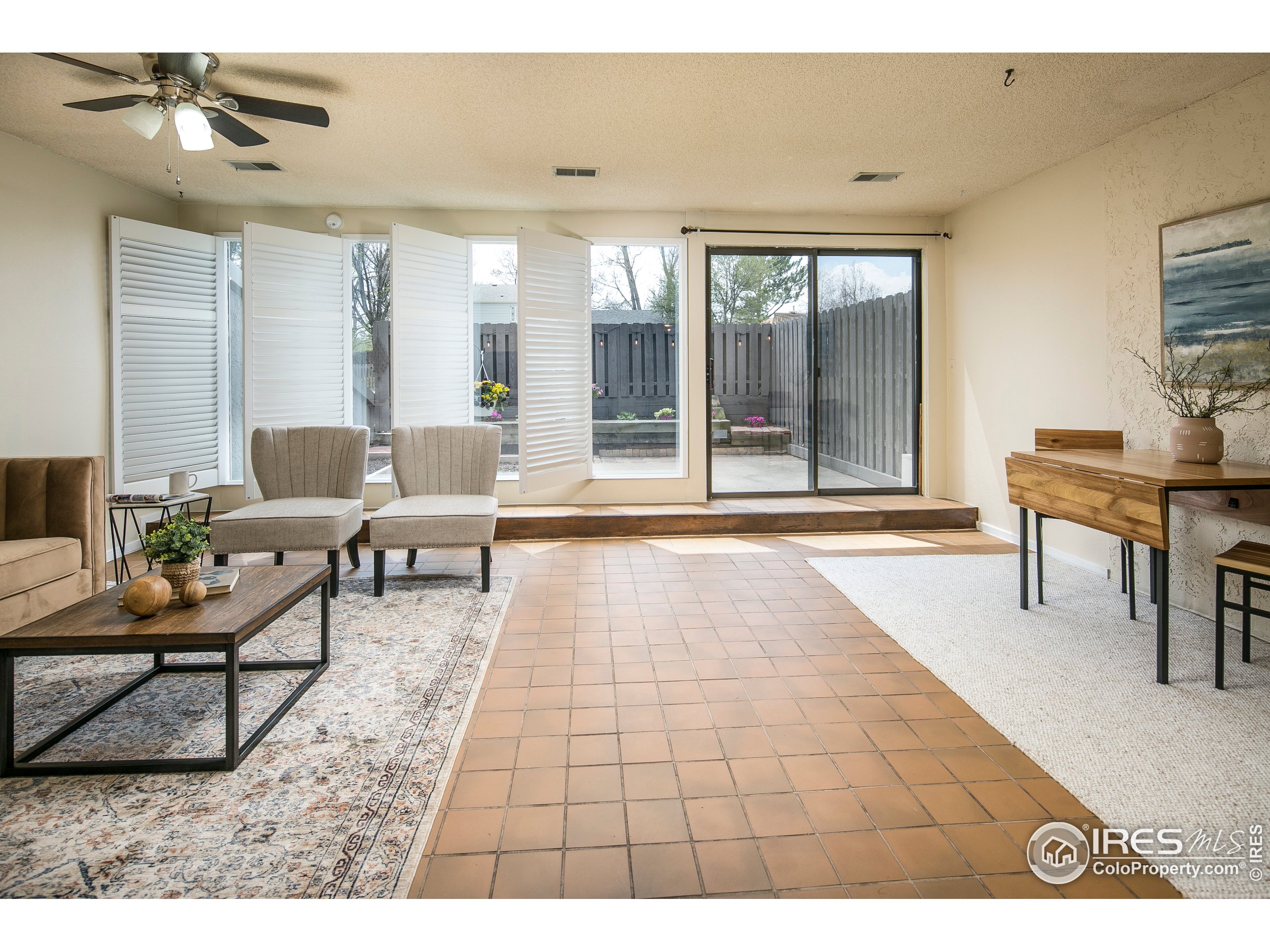 595 West Street Louisville, CO 80027 - Photo 6 of 26 a living room with furniture and a rug