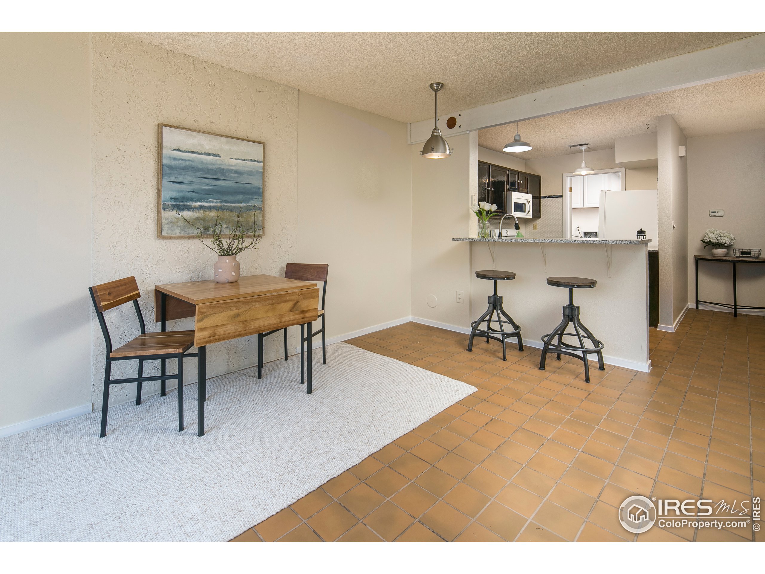 595 West Street Louisville, CO 80027 - Photo 8 of 26 a view of a livingroom and dining room