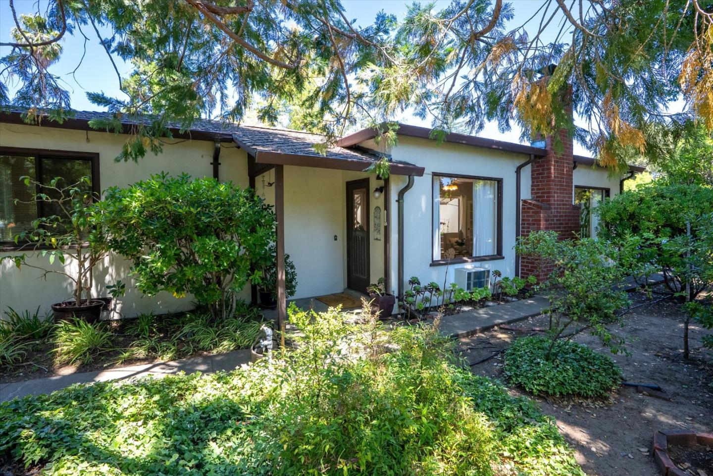 16899 Kennedy Road Los Gatos, CA 95032 - Photo 25 of 61 a front view of a house with garden