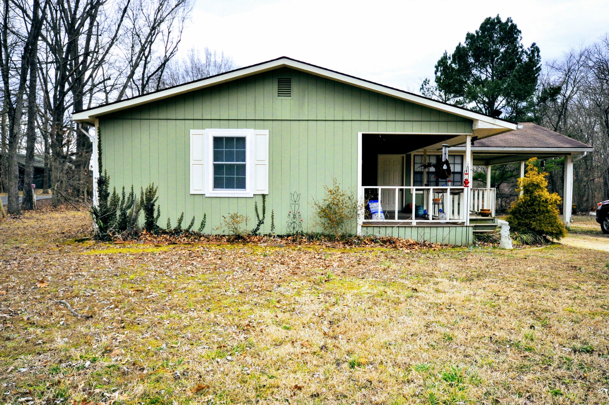 290 Lakeview Manor Road Springville, TN 38256 - Photo 1 of 36 a front view of a house with garden