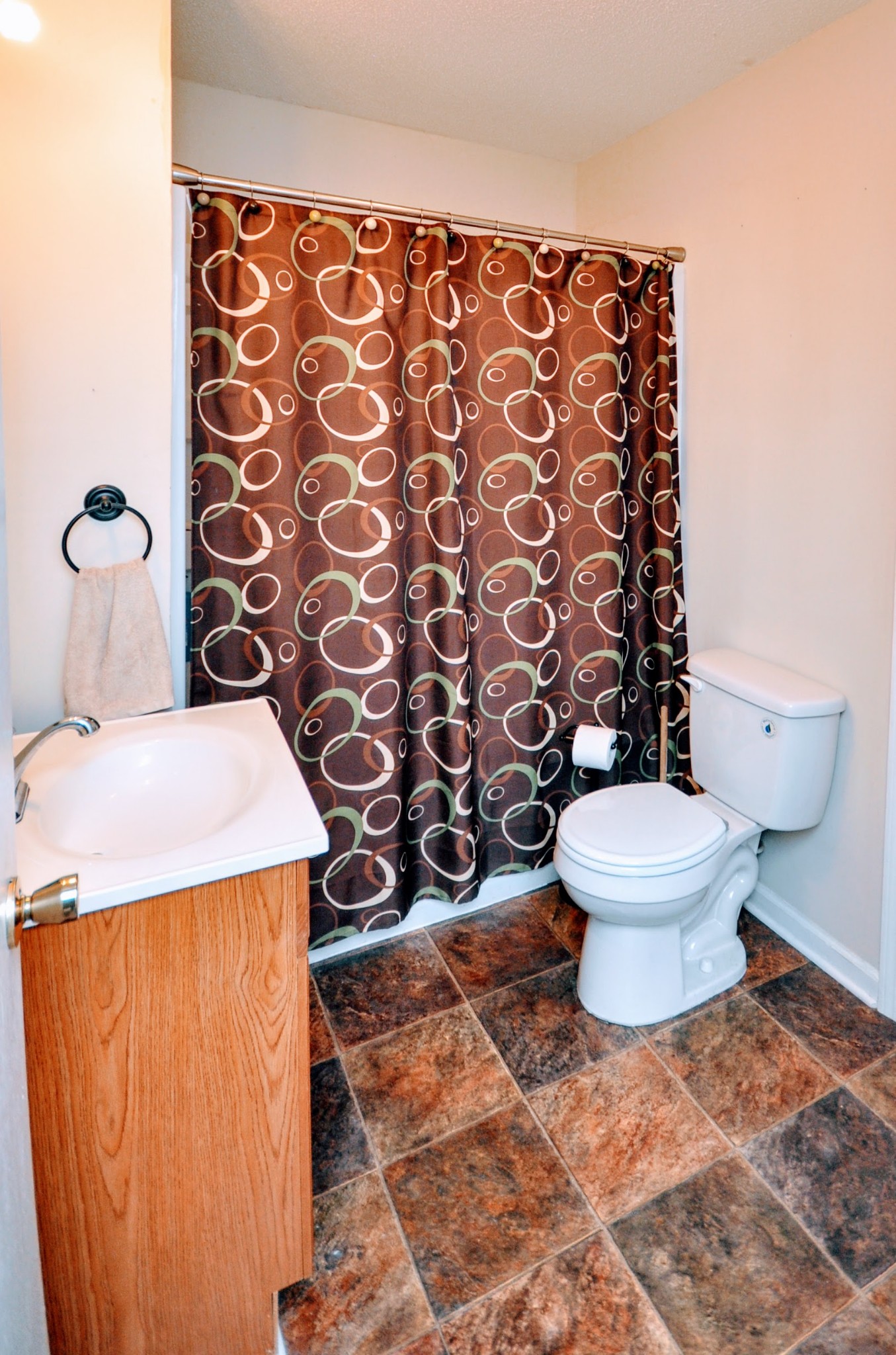 290 Lakeview Manor Road Springville, TN 38256 - Photo 11 of 36 a bathroom with a toilet and a shower curtain