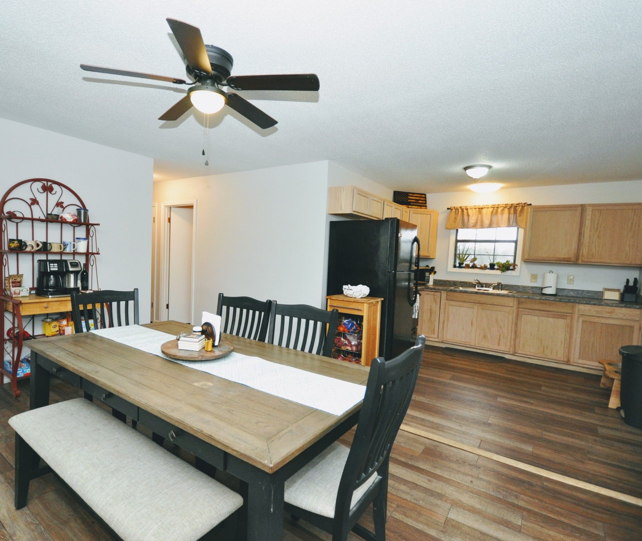 290 Lakeview Manor Road Springville, TN 38256 - Photo 20 of 36 a view of a dining room with furniture window and wooden floor