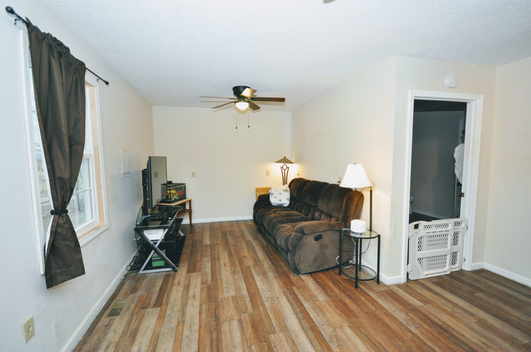 290 Lakeview Manor Road Springville, TN 38256 - Photo 3 of 36 a living room with furniture and a wooden floor