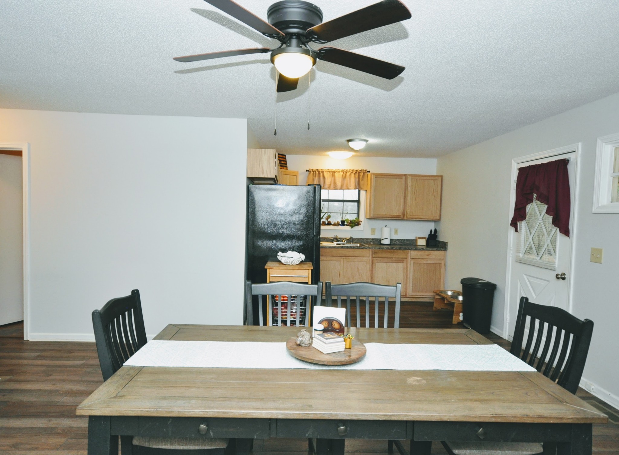 290 Lakeview Manor Road Springville, TN 38256 - Photo 22 of 36 a dining room with wooden floor