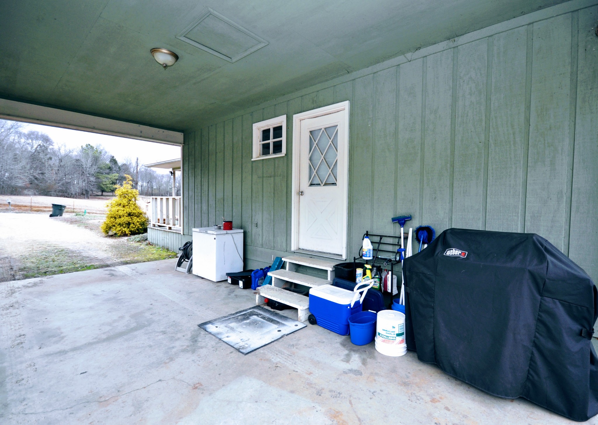 290 Lakeview Manor Road Springville, TN 38256 - Photo 30 of 36 a living room with furniture and a gate