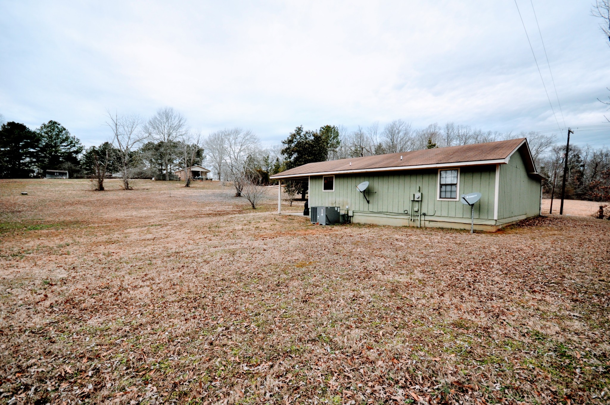 290 Lakeview Manor Road Springville, TN 38256 - Photo 33 of 36 a front view of a house with a garden