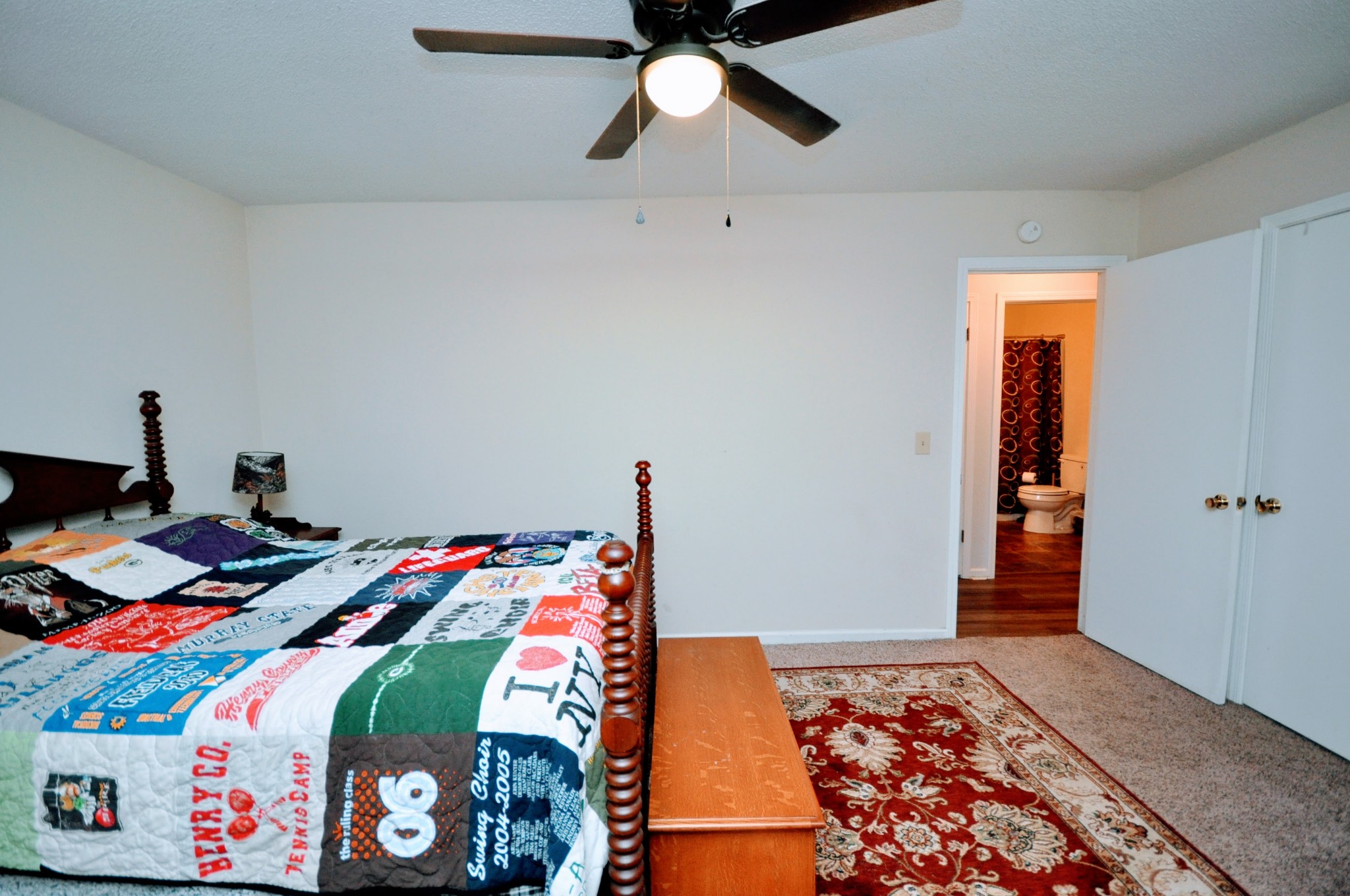 290 Lakeview Manor Road Springville, TN 38256 - Photo 10 of 36 a bed sitting in a bedroom next to a window