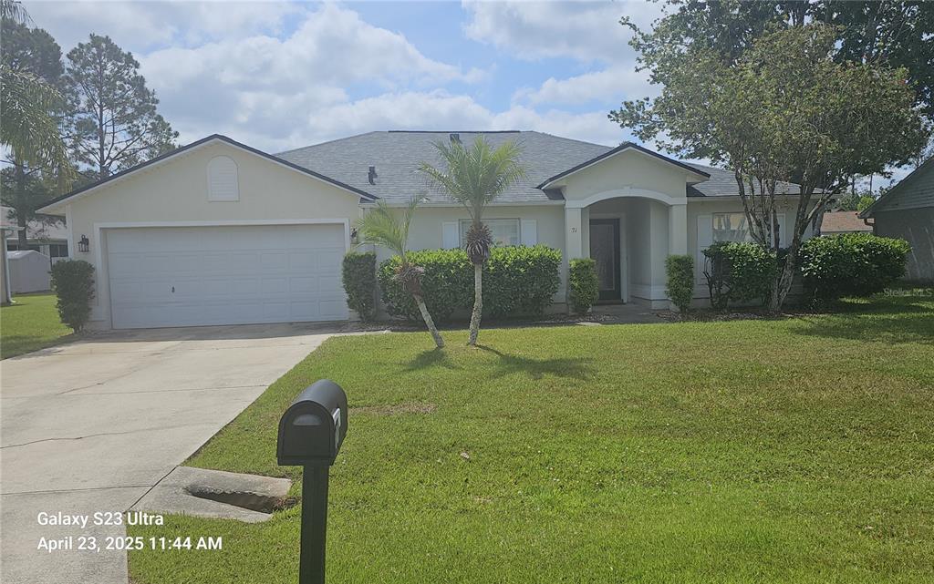 71 Kashmir Trail Palm Coast, FL 32164 - Photo 1 of 1 a front view of house with yard and green space