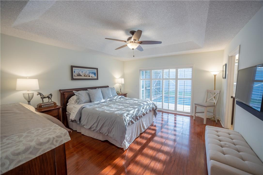 108 West Lee Road Delray Beach, FL 33445 - Photo 15 of 32 a spacious bedroom with a bed and a couch