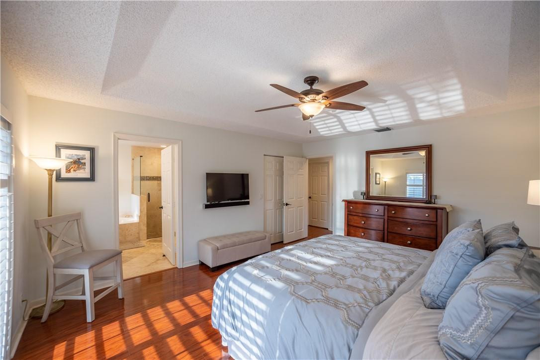 108 West Lee Road Delray Beach, FL 33445 - Photo 16 of 32 a bedroom with a bed and a flat screen tv