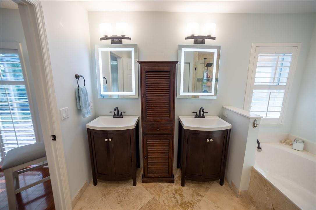 108 West Lee Road Delray Beach, FL 33445 - Photo 18 of 32 a bathroom with a sink and a mirror