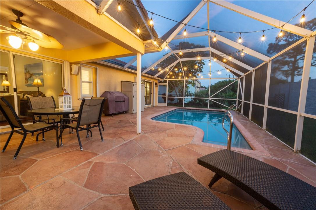 108 West Lee Road Delray Beach, FL 33445 - Photo 26 of 32 a view of a patio with a table and chairs