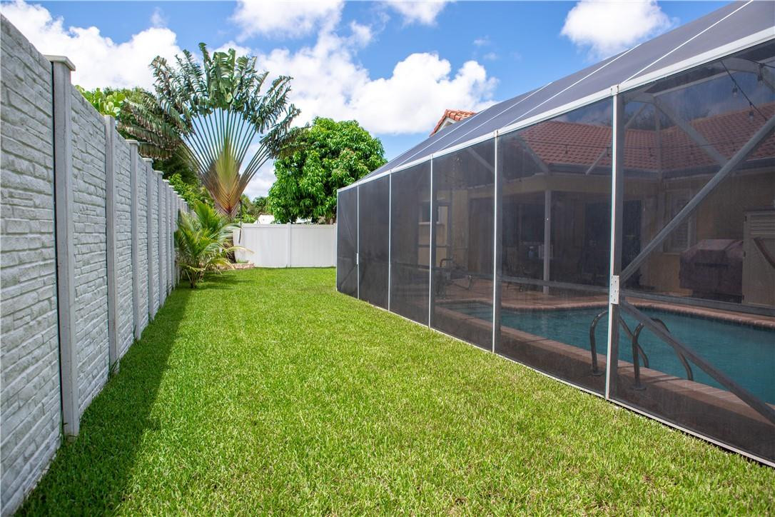 108 West Lee Road Delray Beach, FL 33445 - Photo 30 of 32 a view of a backyard with a garden