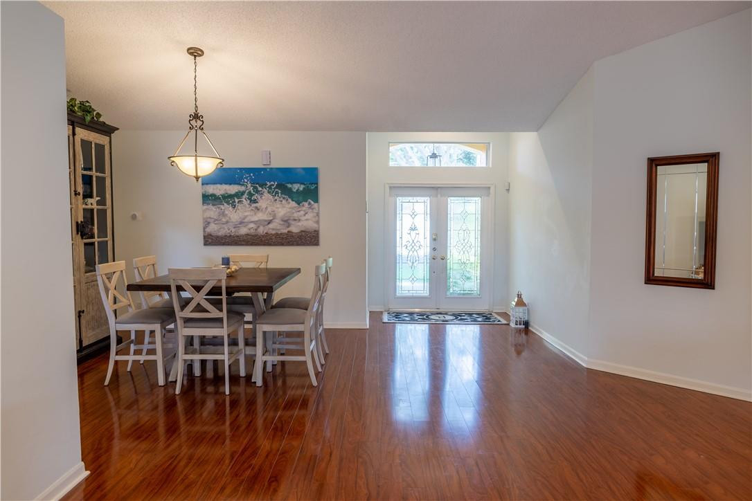 108 West Lee Road Delray Beach, FL 33445 - Photo 3 of 32 a dining room with furniture window entryway and wooden floor
