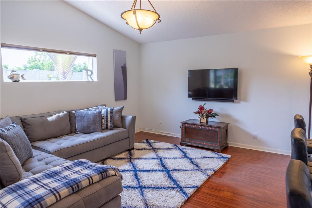 108 West Lee Road Delray Beach, FL 33445 - Photo 9 of 32 a living room with furniture and a flat screen tv