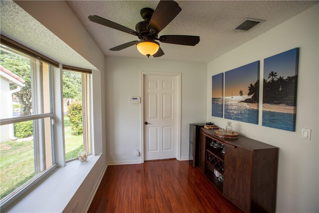 108 West Lee Road Delray Beach, FL 33445 - Photo 10 of 32 a view of empty room with wooden floor and fan
