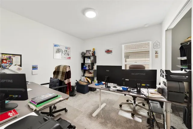 a view of a living room with wooden floor