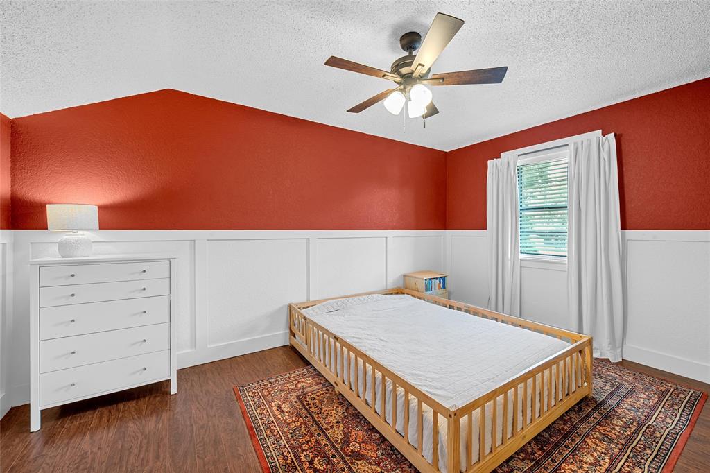 3000 North 15th A Street Waco, TX 76708 - Photo 19 of 24 a bedroom with a bed and a dresser