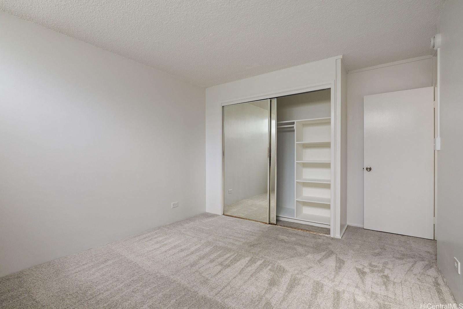 3103 Pualei Circle, Unit 203 Honolulu, HI 96815 - Photo 16 of 25 A 2nd bedroom with lots of built-in storage and a large closet.