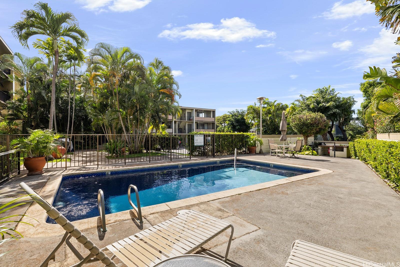 3103 Pualei Circle, Unit 203 Honolulu, HI 96815 - Photo 20 of 25 Enjoy lounging by the pool or barbecuing in the grill area on the right.