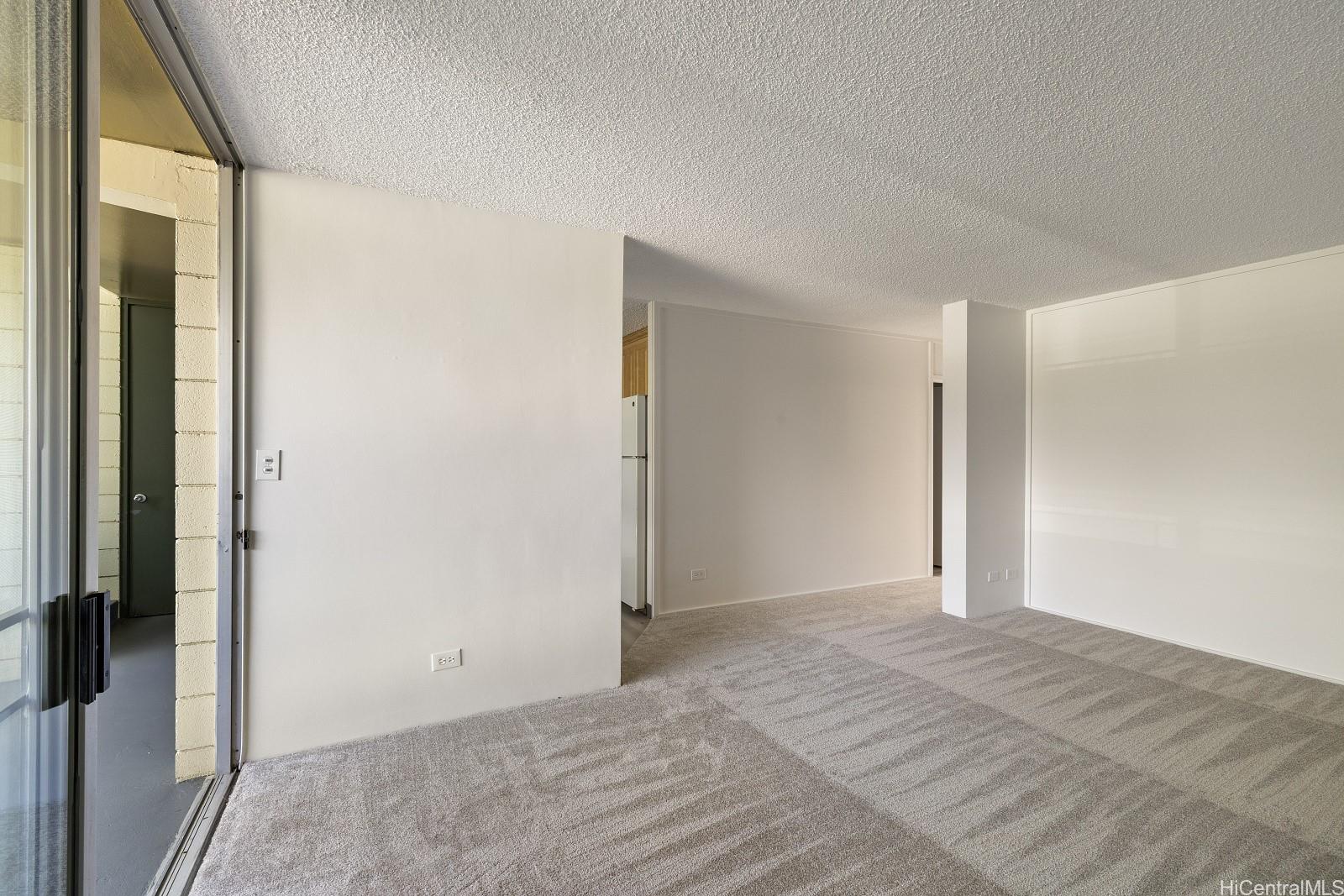 3103 Pualei Circle, Unit 203 Honolulu, HI 96815 - Photo 6 of 25 The kitchen is to the left of the hallway. Bedrooms to the right.