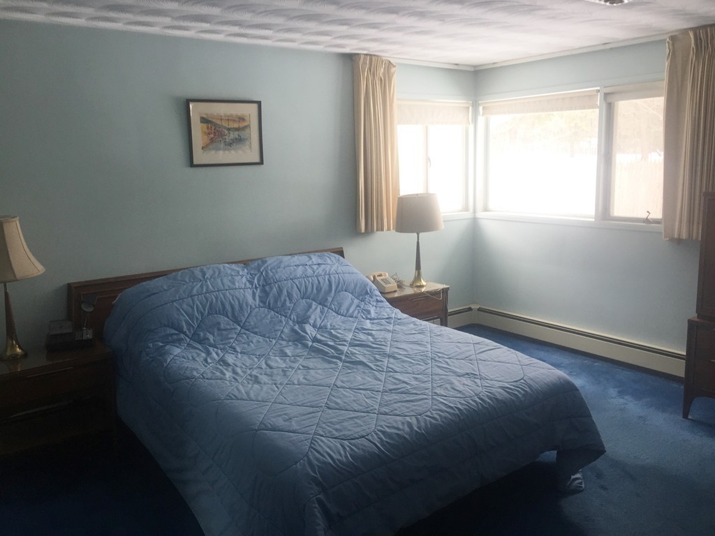 12 Nadine Road Framingham, MA 01701 - Photo 12 of 21 a bedroom with a bed and a window